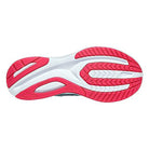 The image shows the sole of the Saucony Guide 16 Running Shoe - Womens, featuring a mainly white outsole with bright pink traction zones, grooved and textured sections for grip, flexibility, and cushioned support.