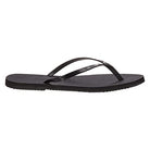 The Havaianas Slim Metalic - Womens flip-flop features a black textured sole and thin, glossy straps, displayed in a side view against a plain white background.
