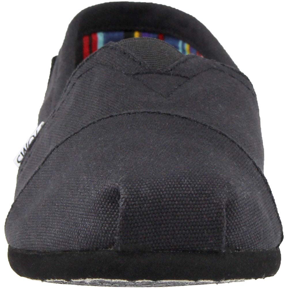 Front view of the TOMS Classic Canvas - Men slip-on in black, featuring a rounded toe, visible stitching, and an interior with the brands signature colorful striped lining.