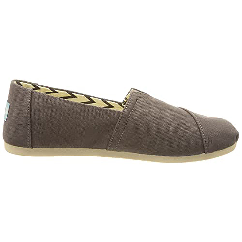 A side view of the TOMS Alpargata - Womens slip-on from the earthwise collection, featuring recycled cotton canvas in brown, a beige sole, and a zigzag-patterned lining.