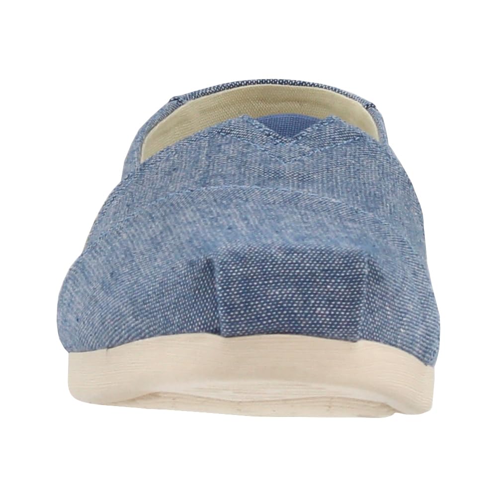 A front view of the TOMS Alpargata ESP for women, a casual slip-on crafted from blue denim with a textured off-white sole, showcasing TOMS’ signature buy one, give one promise.