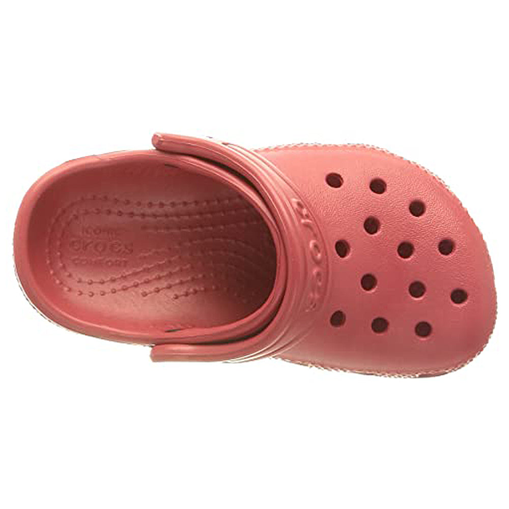 A top view of a single pink Crocs Classic Clog - Kids shoe, featuring ventilation holes on the toe and an adjustable heel strap.