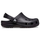 The Crocs Classic Clog - Kids, shown in black with ventilation holes and an adjustable back strap, is displayed from the side against a white background.