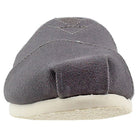 A front view of the TOMS Alpargata ESP slip-on for women in gray canvas with visible stitching and a white rubber sole, highlighting the brands iconic design and their buy-one-give-one commitment.