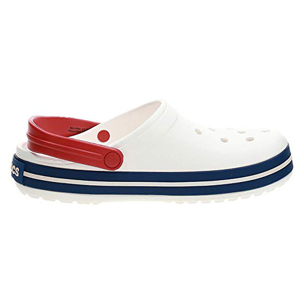 The Crocs Crocband Clog Seasonal Colors - Unisex in white features ventilation holes, a navy blue stripe on the sole, and a bold red heel strap.