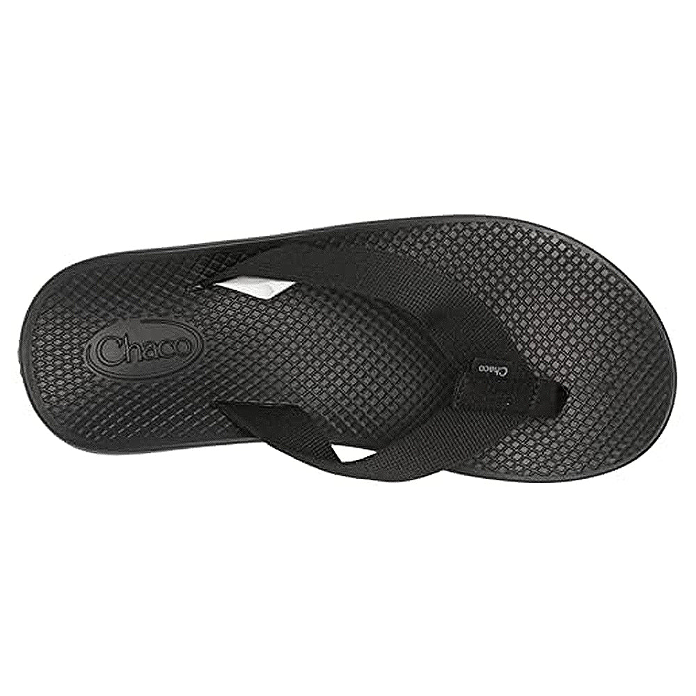 The Chaco Classic Flip - Men in black features a textured sole, woven straps, and an embossed logo on the footbed. A durable ChacoGrip rubber outsole provides reliable traction on every step.