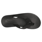 The Chaco Classic Flip - Men in black features a textured sole, woven straps, and an embossed logo on the footbed. A durable ChacoGrip rubber outsole provides reliable traction on every step.