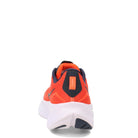 Rear view of the Saucony Ride 15 - Womens lightweight running shoe in orange with a white sole and dark accents, displayed on a plain white background.
