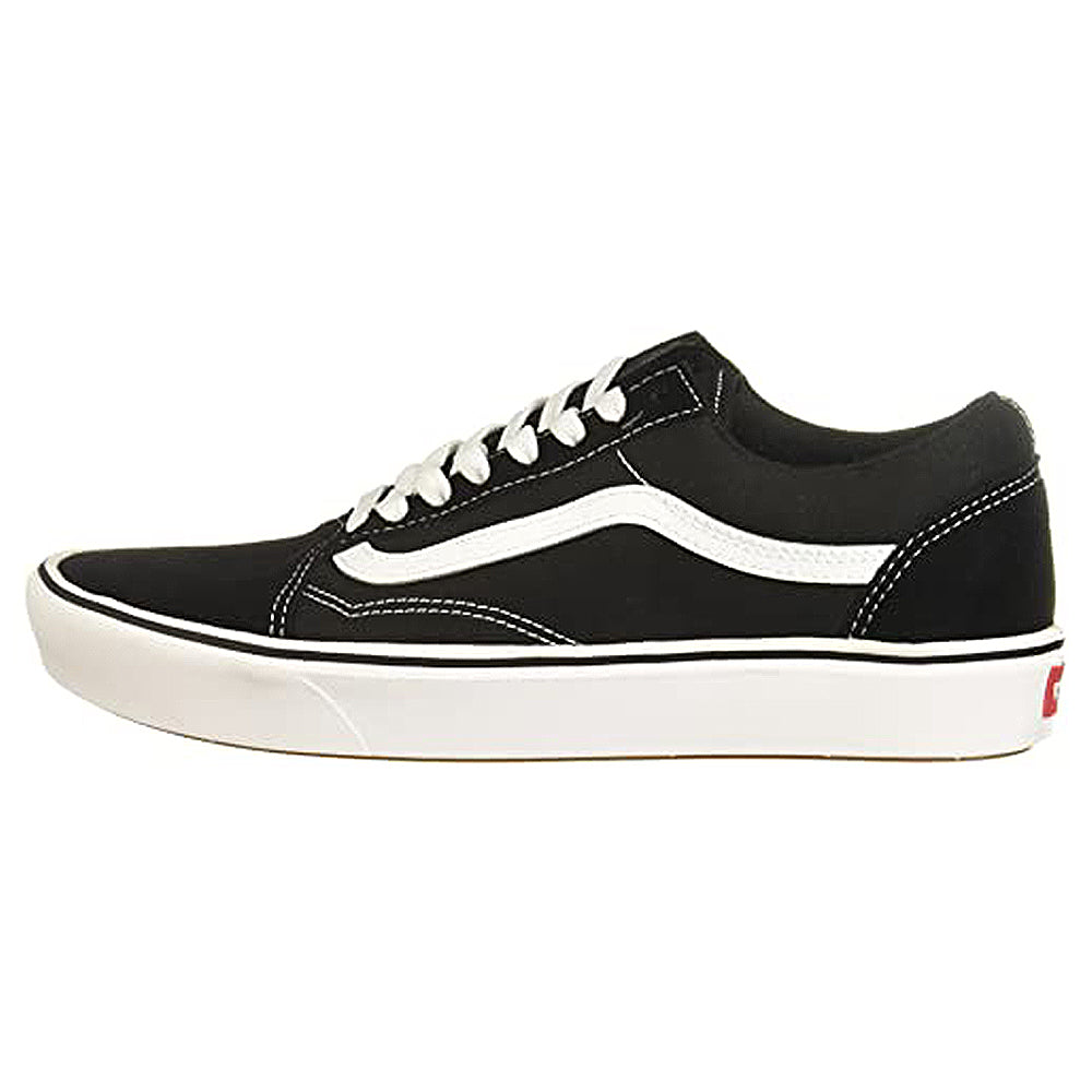 The Vans ComfyCush Old Skool - Unisex is a black and white low-top sneaker featuring white laces, white stitching, a wavy white side stripe, a white sole, and a red Vans label on the heel.