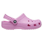 A single Crocs Classic Clog - Kids in pink with ventilation holes and an adjustable heel strap is shown from the side on a white background—ideal everyday comfort footwear for kids.