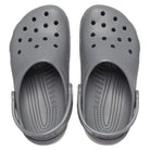 A pair of Crocs Classic Clog - Kids in gray, featuring ventilation holes and adjustable heel straps, displayed from above on a white background.