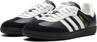 The adidas Samba OG - Men features a black leather upper, white stripes, white laces, gold Samba text, and a black sole. This classic low-top sneaker is perfect for street style.