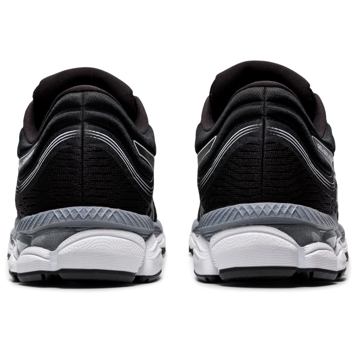 A pair of black ASICS Gel-Ziruss 3 - Mens running shoes seen from the back, highlighting the textured heel, white and gray midsoles, and reflective accents.