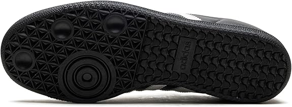 The image shows the black rubber sole of the adidas Samba OG - Men, featuring unique circular and hexagonal tread patterns and an embossed adidas logo—ideal for street style when matched with its signature leather upper.