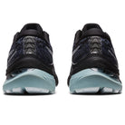 A rear view of a pair of ASICS Gel Kayano 29 - Mens running shoes in black and blue with light blue soles, showing heel and tread details for stability, placed side by side on a white background.