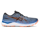 The ASICS Gel Cumulus 24 - Mens is a blue and gray running shoe with orange accents, a white midsole, orange outsole, FF BLAST cushioning, black laces, and the ASICS logo on the side—ideal as an everyday trainer.