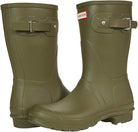 A pair of olive green Hunter Original Short Rain Boots for women, featuring adjustable side straps and textured soles—one boot upright, the other angled forward—for a stylish festival look.
