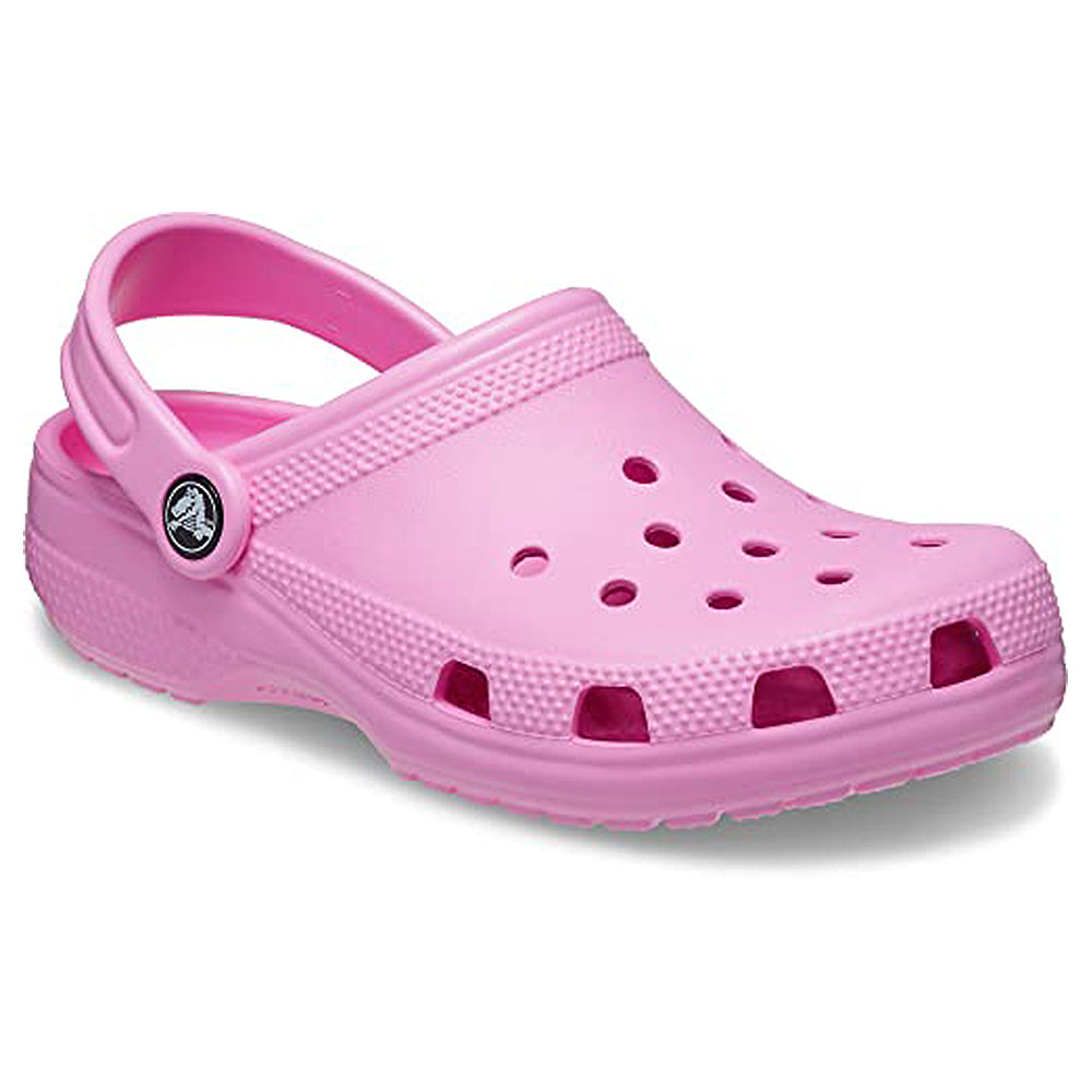 A single light pink Crocs Classic Clog - Kids shoe, featuring ventilation holes and an adjustable heel strap, is shown on a white background.