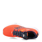 The Saucony Ride 15 - Womens is a bright orange running shoe with dark blue laces, white cushioned sole, and mesh upper, shown on its side to highlight both the top and front design details.