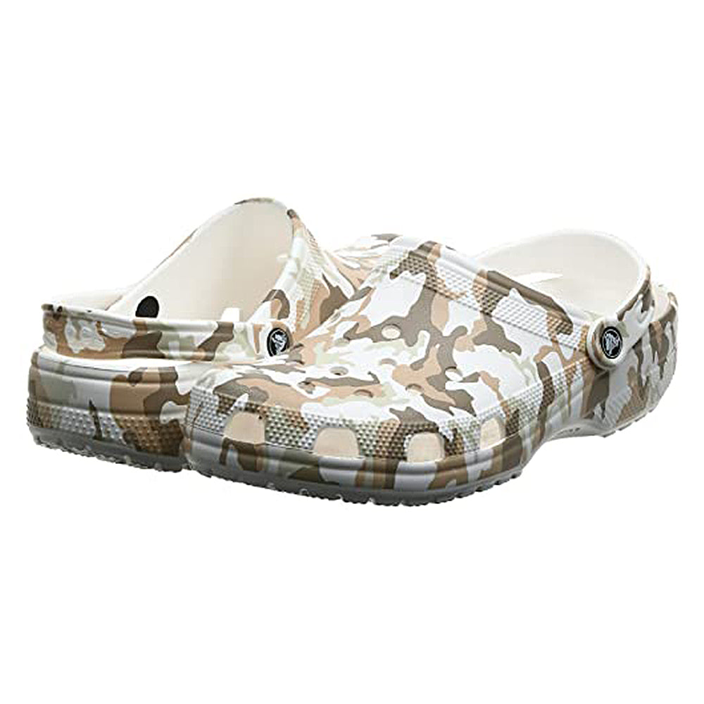A pair of Crocs Classic Camo Clog - Unisex slip-on shoes in beige, brown, and white camouflage with ventilation holes and adjustable heel straps, displayed at a slight angle.