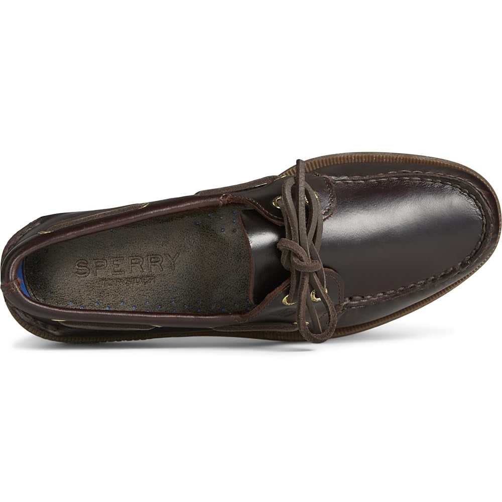 Top view of the Sperry A/O 2-EYE LEATHER mens boat shoe in dark brown, featuring leather laces through gold eyelets, visible toe stitching, and an insole marked with the Sperry logo.