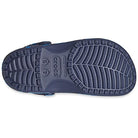 The image shows the sole of a navy blue Crocs Classic Camo Clog - Unisex, featuring a textured tread pattern and sizing details. Designed for comfort by Crocs, these slip-on water shoes are ideal for all-day wear.