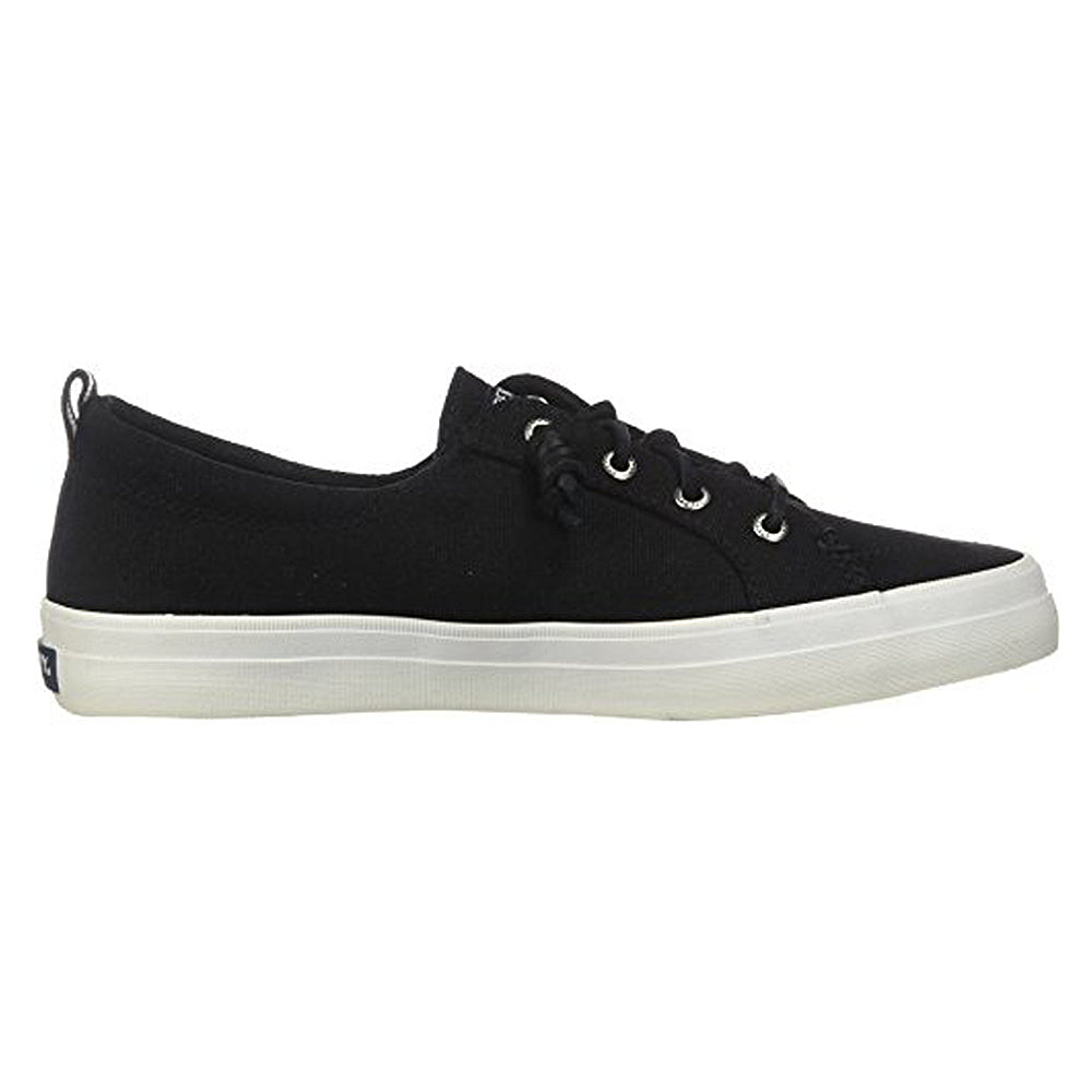 The Sperry Crest Vibe - Womens is a black canvas sneaker with black laces, silver eyelets, and a white rubber sole, shown side view on a plain background. This durable shoe provides great arch support for all-day comfort.