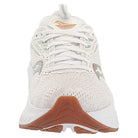 The Saucony Echelon 9 Running Shoe - Womens is shown from the front, featuring a seamless white upper, white laces, a textured brown rubber sole, and subtle gray and tan accents on the sides and tongue.
