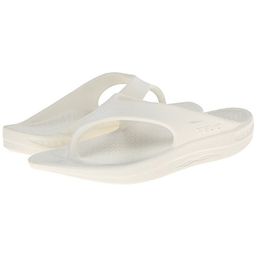 A pair of white Telic Footwear Energy Flip Flop - Unisex sandals with thick soles, pillow-soft cushioning, and a thong strap design are shown on a plain white background.
