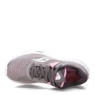 A top view of the Saucony Ride 15 - Womens running shoe shows a light gray upper with pink accents, white sole, breathable mesh, PWRRUN cushioning, and Saucony branding on the side and tongue.