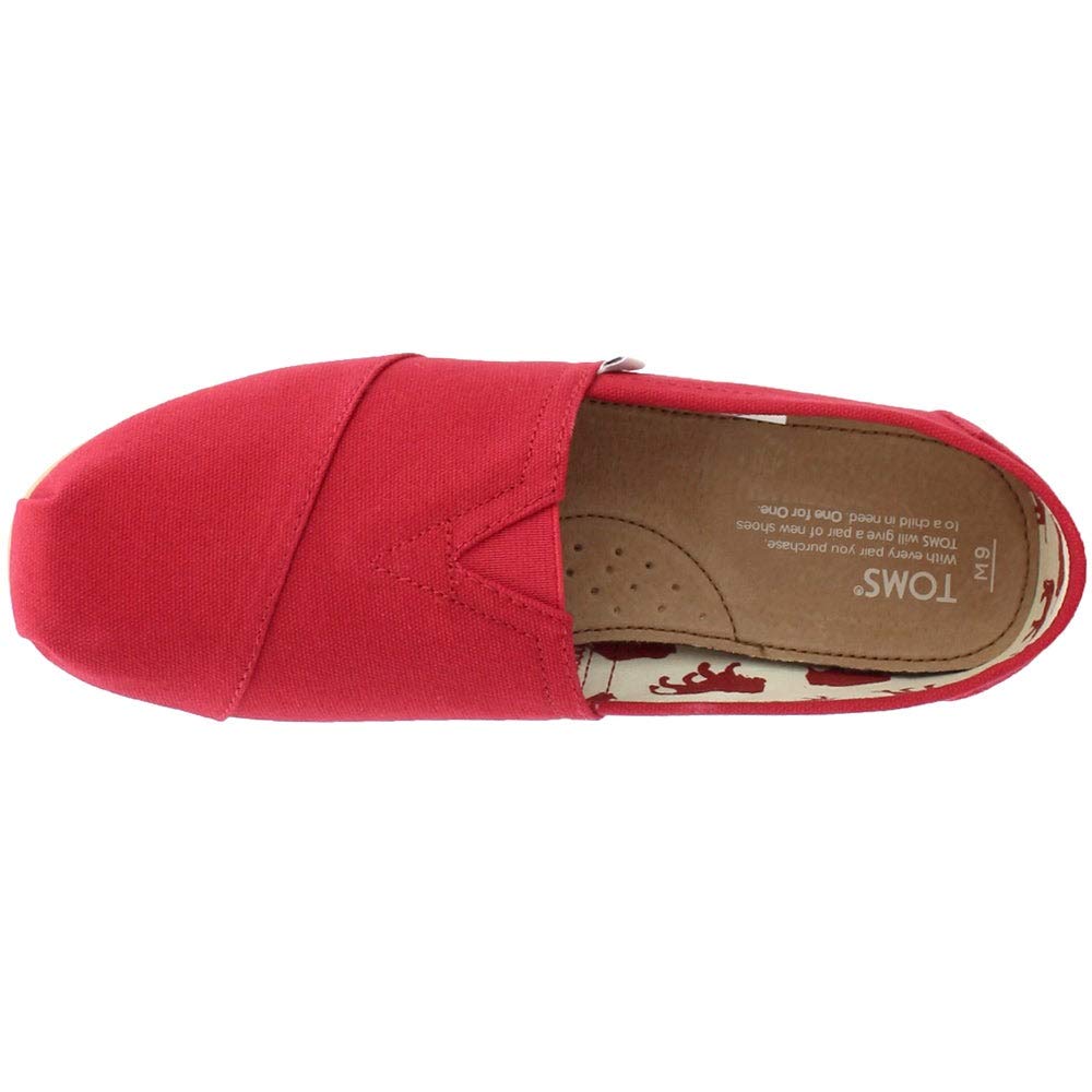 Top view of a single red TOMS Classic Canvas - Men slip-on with a beige insole displaying printed text and small perforations for breathability. The interior shows a patterned lining near the heel.