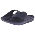 A pair of dark blue Telic Footwear Energy Flip Flop - Unisex sandals with thick, pillow-soft cushioning and textured footbeds, shown slightly overlapping each other.