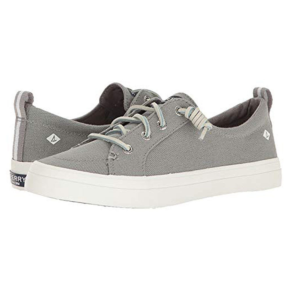 The Sperry Crest Vibe - Womens features light gray canvas uppers, white rubber soles and laces, subtle logo accents on the side and heel tab, durable construction, and arch support—all shown against a white background.