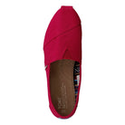 A top view of the TOMS Alpargata ESP - Women in red, featuring visible stitching, a tan insole with branding and sizing, a patterned heel lining, and the brand’s signature slip-on style reflecting their buy one give one philosophy.
