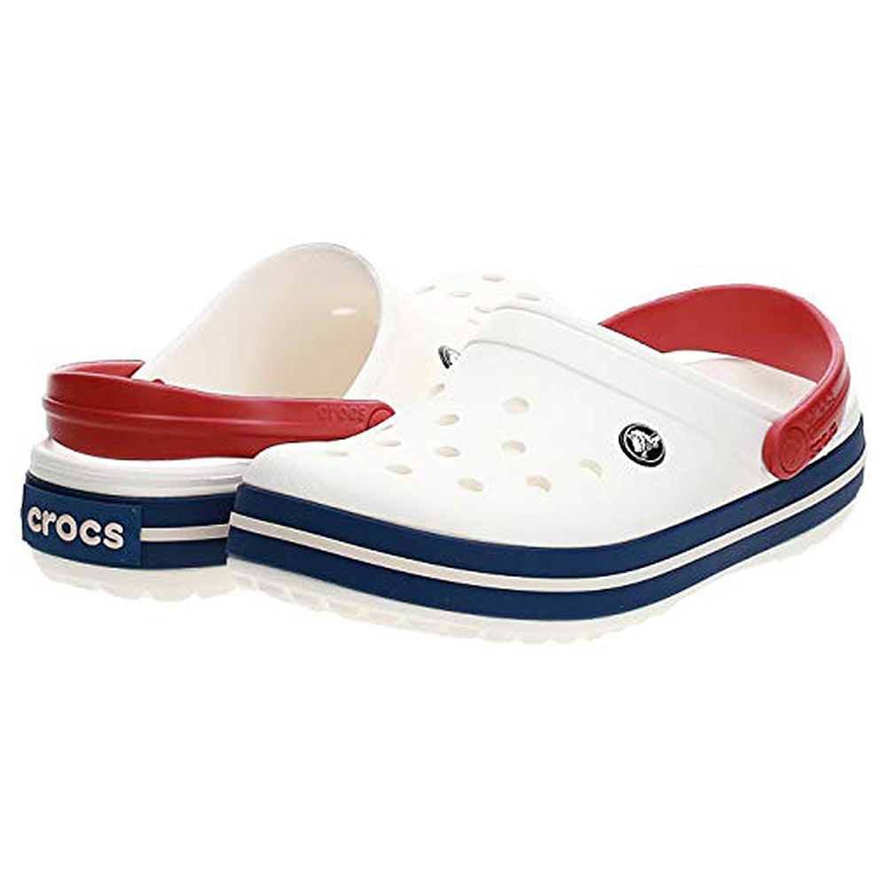 The Crocs Crocband Clog Seasonal Colors - Unisex features blue stripes on the sole, red heel straps, ventilation holes, and the iconic Crocs logo. Available now!.