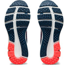 The image displays the soles of the ASICS GEL-PULSE 12 - Womens, featuring a dark blue design with white grooves and a bright coral toe section, highlighting grip and cushioning from the AmpliFoam midsole.