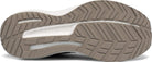 Close-up of the mens Saucony Triumph 18 running shoe sole, highlighting the tan rubber tread with deep grooves for traction, supportive guidance frame details, and the Saucony logo embossed near the center.