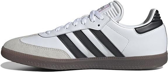 The adidas Samba OG - Men features a white leather upper with black stripes, gum sole, suede toe cap, and padded tongue—all shown in a side profile, making it an ideal choice for street style.