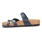 The Birkenstock Mayari Oiled Leather - Women sandal features two dark blue oiled leather straps, a cork contoured footbed, slip-on design, and a low black rubber tread.