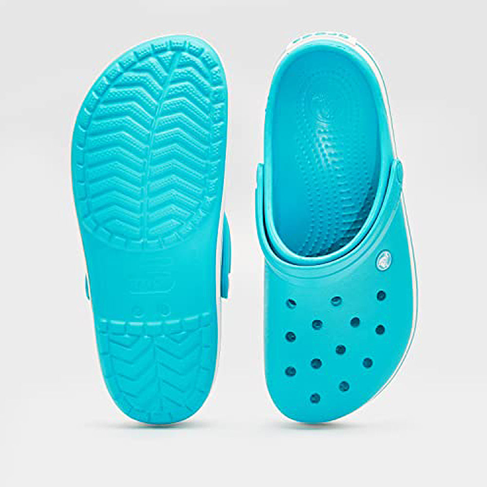 A pair of Crocs Crocband Clog Seasonal Colors - Unisex in bright blue, with one shoe displaying the ventilation holes and the other showing the textured sole, set against a plain light gray background.