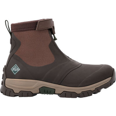 The Apex Mid Zip - Men by The Original Muck Boot Company is a brown and tan ankle-high outdoor boot with a rugged sole, elastic side panels, heel pull tab, Velcro strap at the top, and the Muck Boot logo on the side.