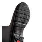 Close-up of the textured black rubber sole on Hunter Original Short Rain Boots - Women, featuring the embossed brand name near the heel and a red circular detail below it, set against a white background. Ideal for festivals and adventures.