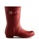 A single Hunter Original Short Rain Boot for women in red, featuring a decorative buckle on the shaft, is displayed on a white background facing right.