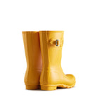 A pair of Hunter Original Short Rain Boots for women in bright yellow with side buckles are displayed on a white background, showing their back and side profiles.